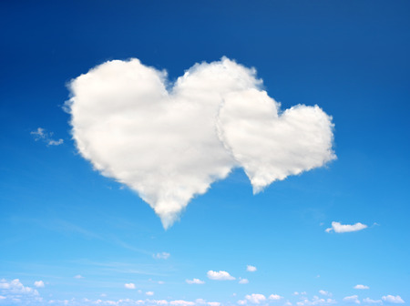 Blue sky with a white clouds in the form of heart. Valentines day.の写真素材