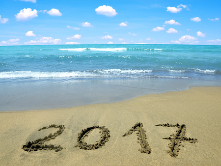 Written 2017 on the beach. Concept of New Year.の写真素材