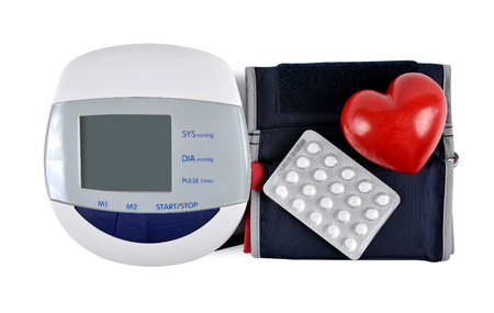 Digital blood pressure monitor with heart and pills isolated on white backgroundの写真素材