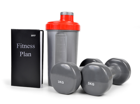 Dumbbells with protein shaker and training plan isolated on white background.の写真素材