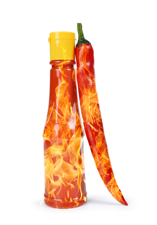Hot sauce in bottle with red chili pepper isolated on a white background.の写真素材