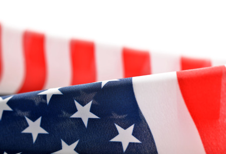 Closeup of American flag on white background.