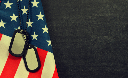 Close up of american flag and soldiers tags with copy space. Veteran Day Concept.の写真素材