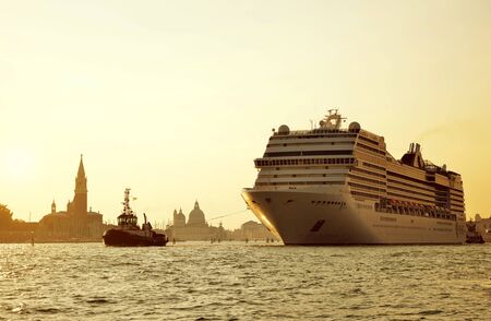 VENICE, ITALY - September 15, 2018: Cruise ship MSC Poesia sailing through the canal at sunset.のeditorial素材