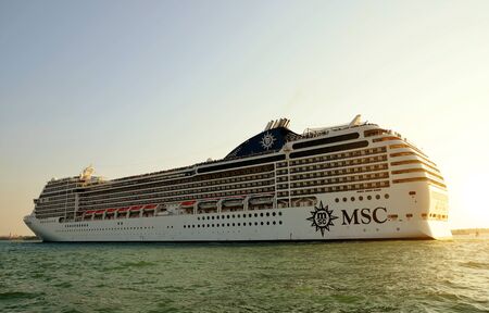 VENICE, ITALY - September 15,2018: Cruise ship MSC Poesia sailing through the canal at sunset.のeditorial素材