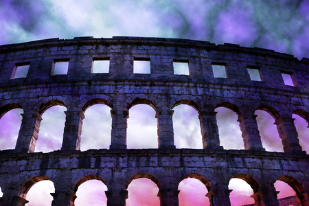 Roman amphitheater with stormy sky in Pula, ancient monument in Croatia.の写真素材