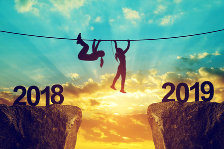 Hikers climb into the New Year 2019 at sunset.