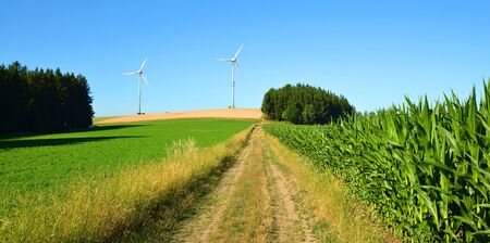 Wind turbines in summer rural landscape. Concept of clean energy. |の写真素材