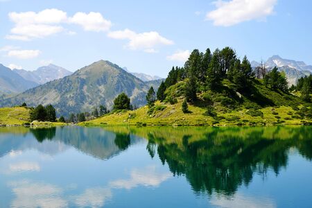 Beautiful mountain landscape in the national nature reserve Neouvielle, Lac de Bastan inferieur, French Pyrenees.の写真素材