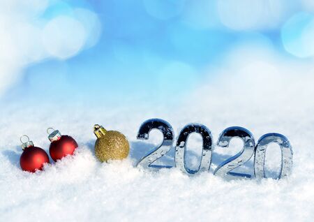 Number 2020 with Christmas decorations in snow. New Year concept.の写真素材