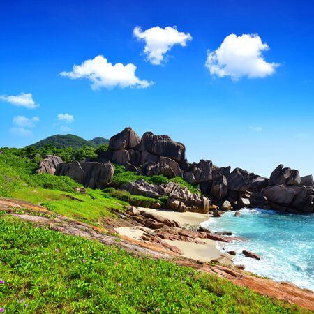 Tropical landscape with big granite rocks close to Anse Songe beach. La Digue Island, Seychelles.の写真素材