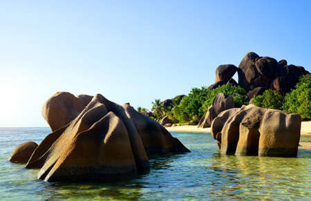 Beatiful beach Anse Source d'Argent with big granite rocks in sunny day. La Digue Island, Seyshelles. Luxury travel destination.の写真素材