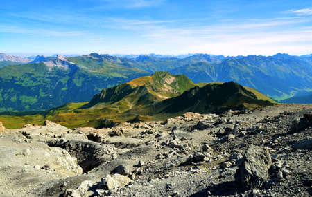 View from the top of mountain Weissfluhjoch above Davos town, Plessur range,Canton of Grisons, Switzerland. Alpine landscape in sunny day.の写真素材