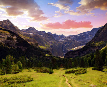Summer mountain landscape at sunset. Cirque de Gavarnie in the Pyrenees national park. France.の写真素材
