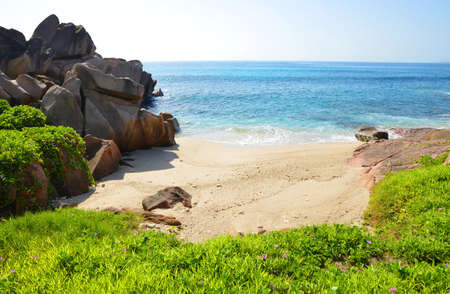 Tropical landscape with big granite rocks close to Anse Songe beach. La Digue Island, Seychelles.の写真素材