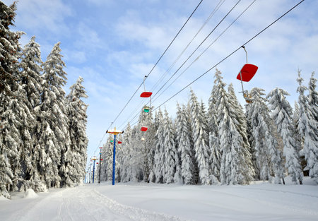 Snowy winter landscape in the National park Sumava, cableway on mount Pancir, Czech Republic.の写真素材