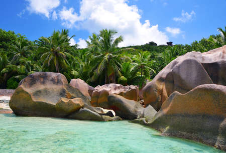 Beatiful beach Anse Source d'Argent with big granite rocks in sunny day. La Digue Island, Seychelles.の写真素材