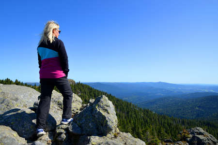 Tourist on the top of Grosser Arber mountain in National park Bayerischer wald, Germany.の写真素材