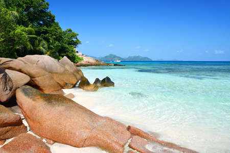 Coast with big granite boulders of the island La Digue, Anse Severe beach, Indian ocean, Seychelles. Tropical destination.の写真素材