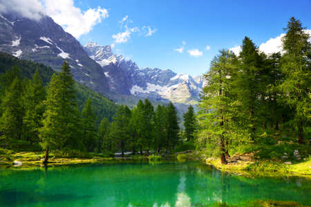 View of the lake Lago Blu near Breuil-Cervinia, Val D'Aosta, Italy. Beautiful mountain landscape in sunny day.の写真素材