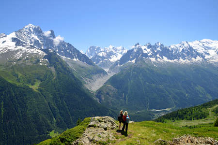 Turists in the Nature Reserve Aiguilles Rouges, Graian Alps, France, Europe.の写真素材
