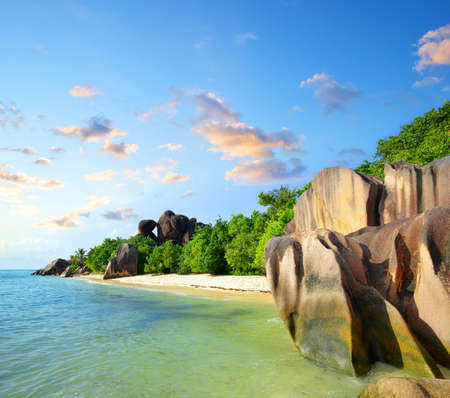 Beautiful beach Anse Source d'Argent with big granite rocks in sunny day. La Digue Island, Seychelles.の写真素材