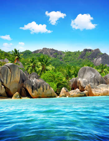 Beautiful beach Anse Source d'Argent with big granite rocks in sunny day. La Digue Island, Indian Ocean, Seychelles. Tropical destination.の写真素材