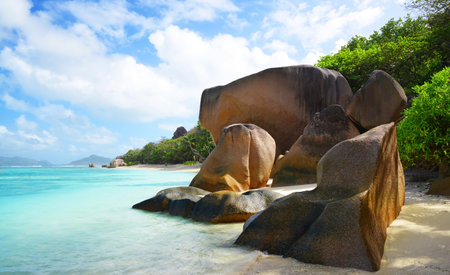 Anse Source d'Argent beach with big granite rocks in sunny day. La Digue Island, Indian Ocean, Seychelles. Tropical destination.の写真素材