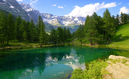 View of the lake Lago Blu near Breuil-Cervinia, Val D'Aosta, Italy. Beautiful mountain landscape in sunny day.の写真素材