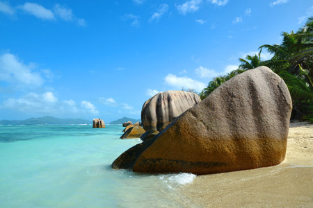 Anse Source d'Argent beach with big granite rocks in sunny day. La Digue Island, Indian Ocean, Seychelles. Tropical destination.の写真素材