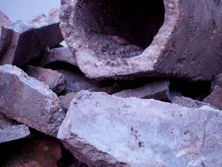 detail gray broken concrete pipes, remnants of sewer repair, old concrete pipe, construction waste,...