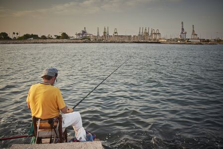 Some pictures of a some fishermen front a mediterranean seaの写真素材