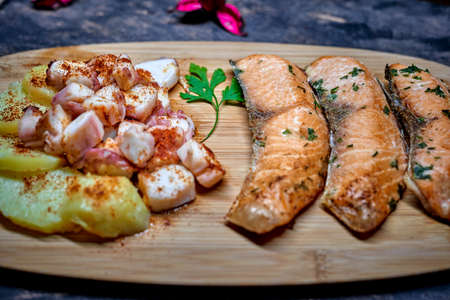 A wood dish with a salmon to dinner todayの写真素材