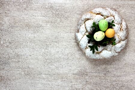 Sweet Easter bunny with easter eggs on wooden table with space for text