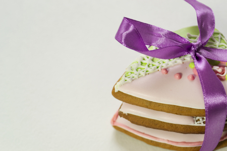 Gingerbread on a white background. Bakery products. Gingerbread in the shape of a heart. Place for text. Gingerbread pattern Background.の写真素材
