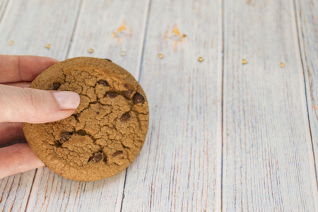 Oatmeal cookies on a light wooden background. Round shape. Concept Easter and Palm Sunday.の写真素材