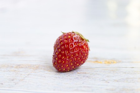Sweet, juicy, ripe strawberries. Red, large strawberries Food with vitamins. Vegetarian food. On a light wooden background.の写真素材
