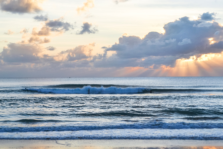 Sky background. Indian Ocean. Bali. Indonesia. Sunset over the ocean. Waves for surfの写真素材