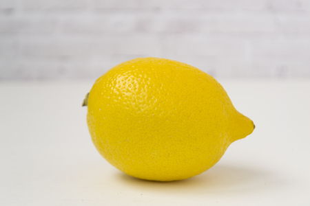 Ripe yellow lemon on white background. There is a place for text.の写真素材