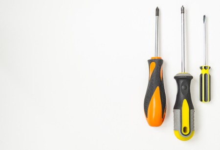Repair tools top view on a white background. Screwdrivers, cutter, pencil, saw, pliers. There is a place for text. Isolate with shadow.の写真素材