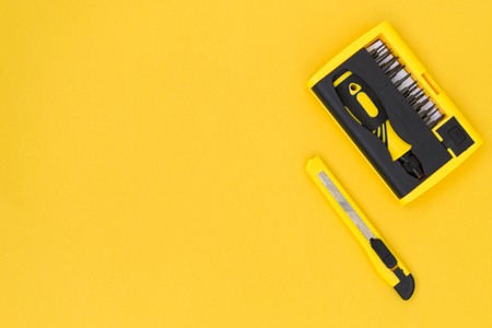 DIY tool kit. Tools lie on a yellow background. There is a place for text. The concept of construction, repair.の写真素材