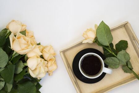 Stylish flatlay frame arrangement with pink laptop, tea, roses, glasses and other accessories on white. Feminine business mockup, copyspaceの写真素材