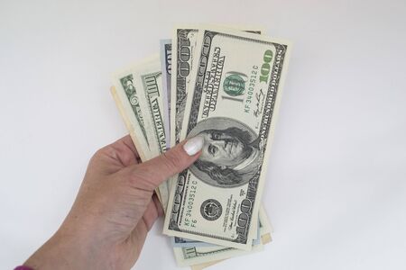 hand with money more hundred dollars isolated on white background. Business concepts, currency...