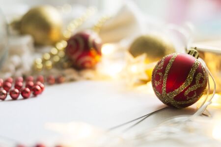 New Year red ball on abstract blurred background. Christmas concept. There is a place for text.の写真素材