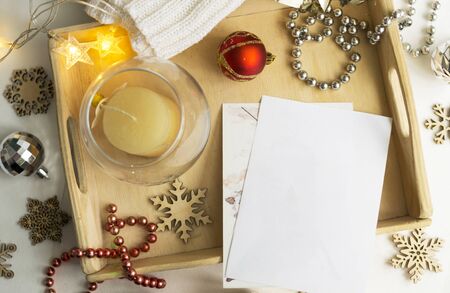 Composition of an empty white christmas card. Festive seasonal decorations, delivery lay flat background template. Christmas concept.の写真素材