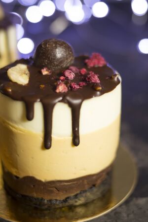 Mousse cake on the shelves at the party. Time to have fun. Selective focus and blurred background. The concept of cooking and holiday treats.の写真素材
