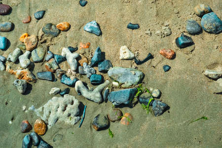 Multi-colored colorful sea pebbles, natural background, texture. Close-up texture of colorful sea pebbles. Sea background and beach.の写真素材