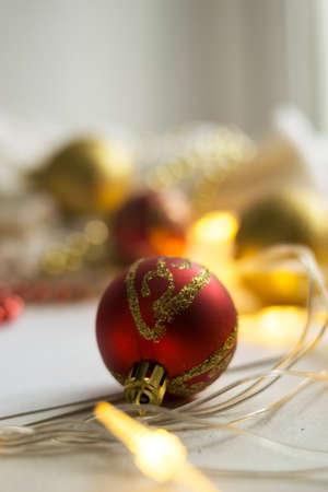 New Year red ball on abstract blurred background. Christmas concept. There is a place for text.の写真素材