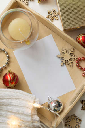 Composition of an empty white christmas card. Festive seasonal decorations, delivery lay flat...