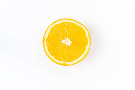 Top view of one orange round fruit on a white background. Rich citrus texture. Copy space.の写真素材